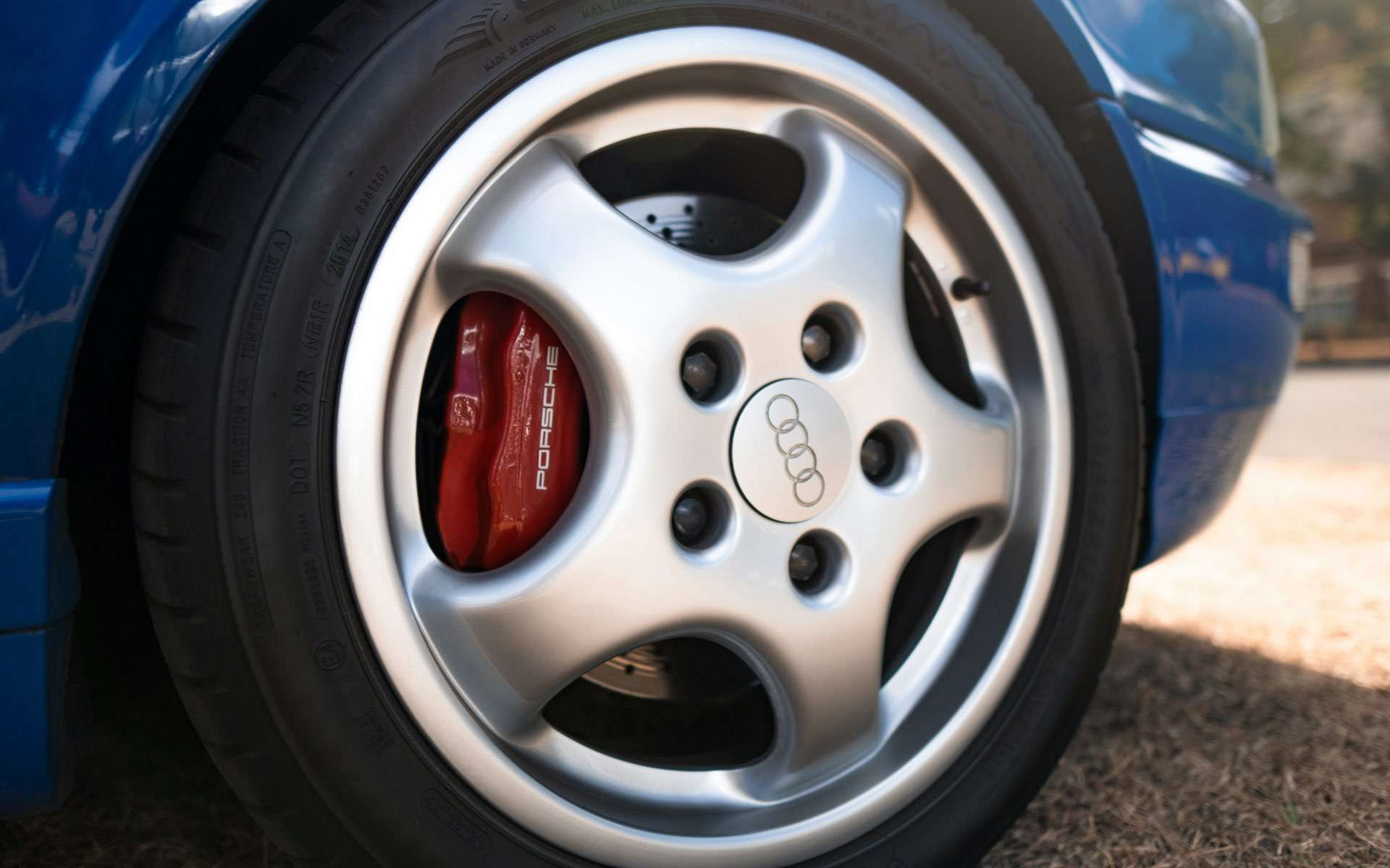 Close up shot of a sports car alloy.