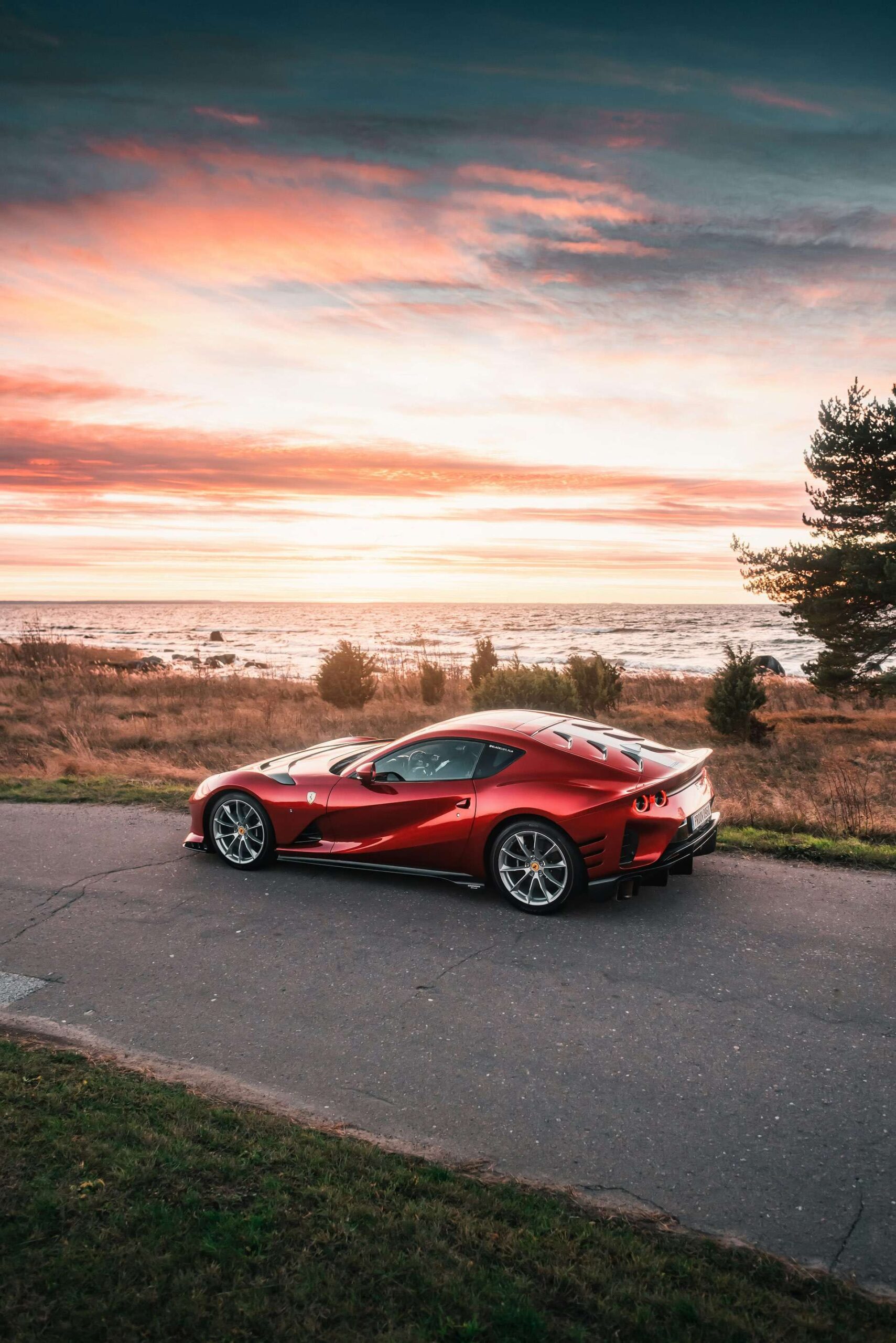 Scenic sunset shot of a Ferrari super car.