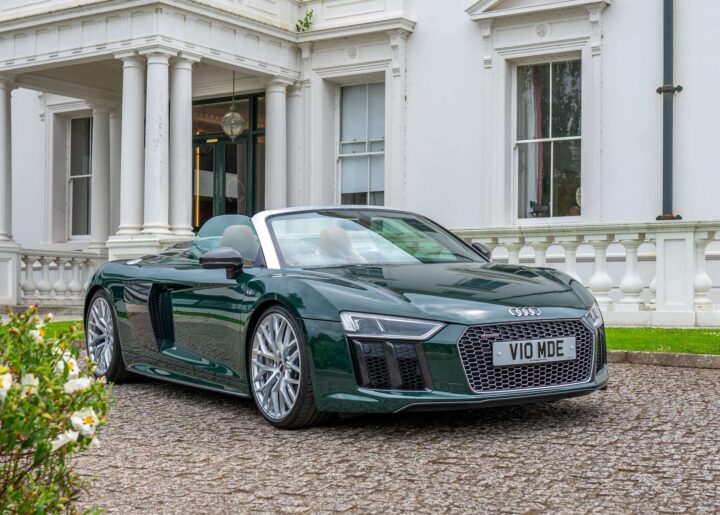 Side profile of an exotic Audi R8 supercar with aerodynamic curves and stunning wheels.