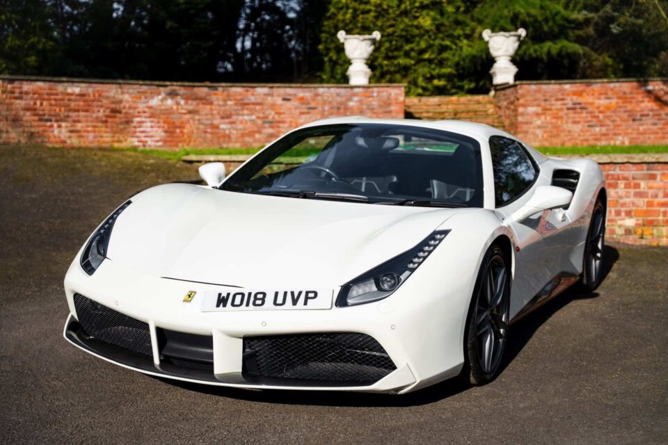 Front view of a luxury Ferrari 488 sports car with sleek design and premium detailing.